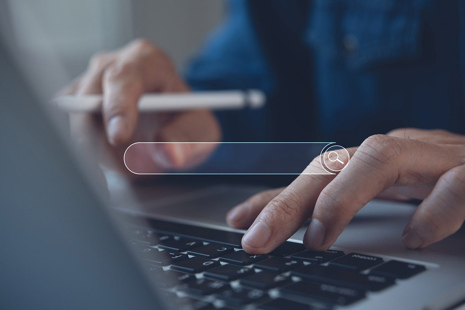 A person typing on a laptop